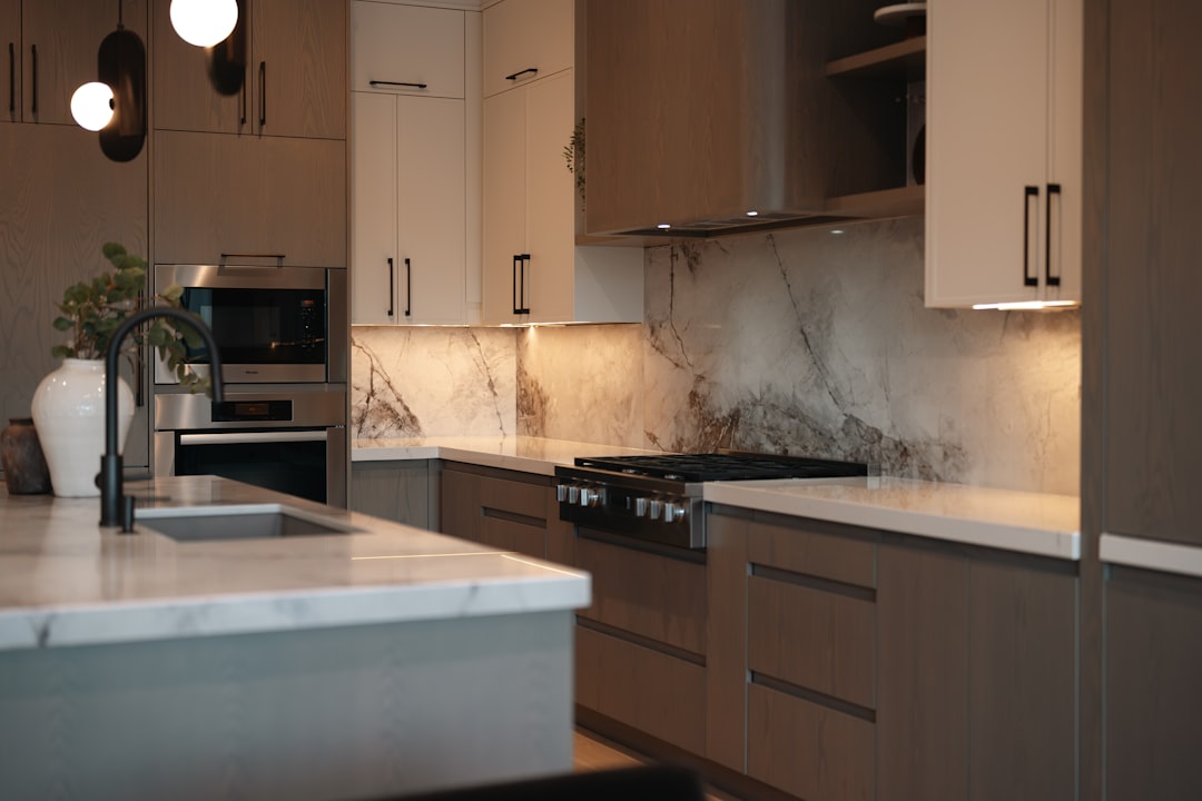 Worn kitchen countertop showing cracks and burn marks in a Round Rock home